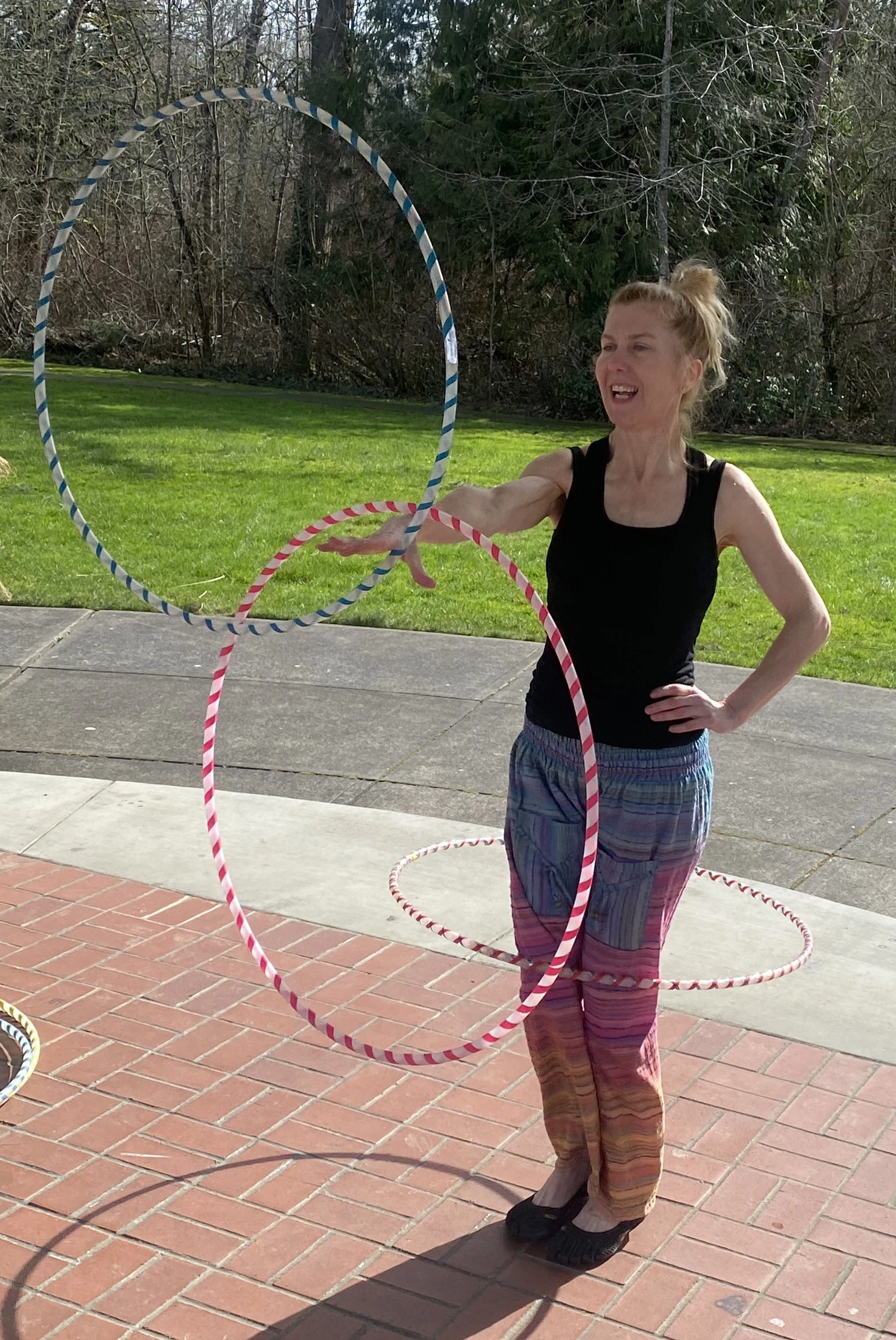 Shanda Button hula hooping outdoors